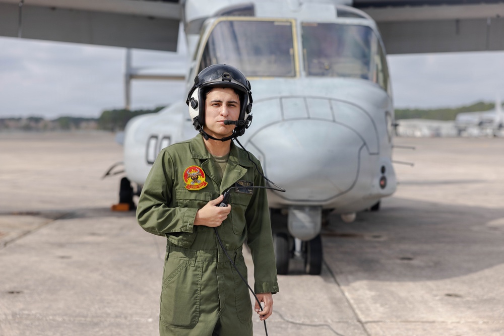 U.S. Marines with VMM-261 conduct maintenance on an MV-22B Osprey