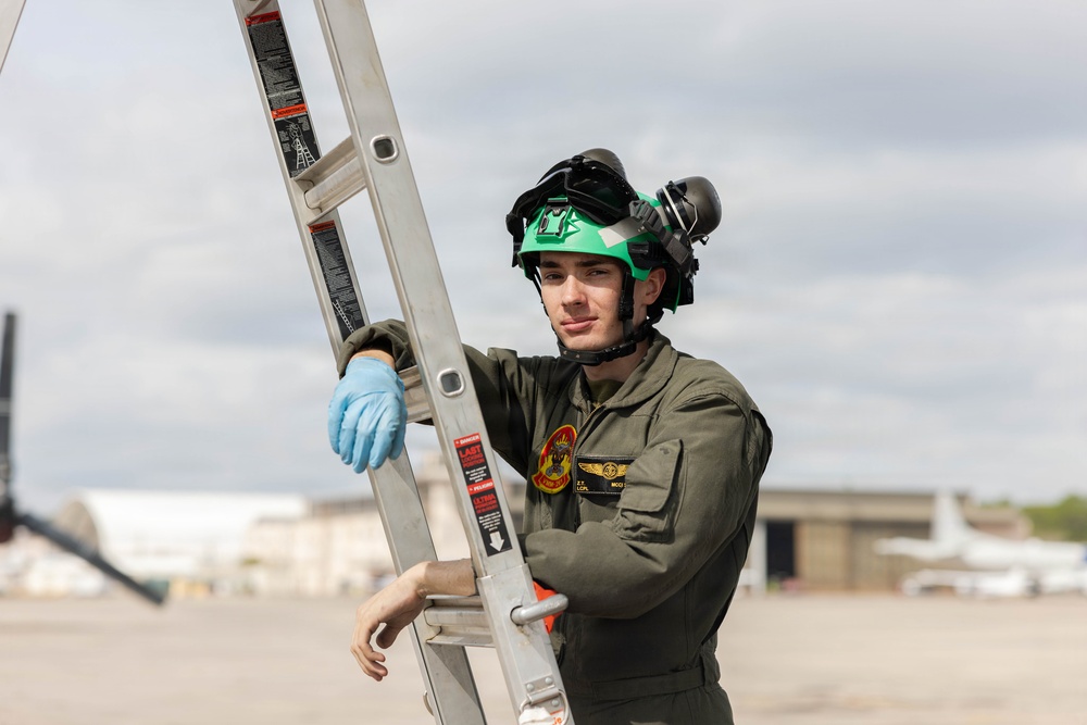 U.S. Marines with VMM-261 conduct maintenance on an MV-22B Osprey