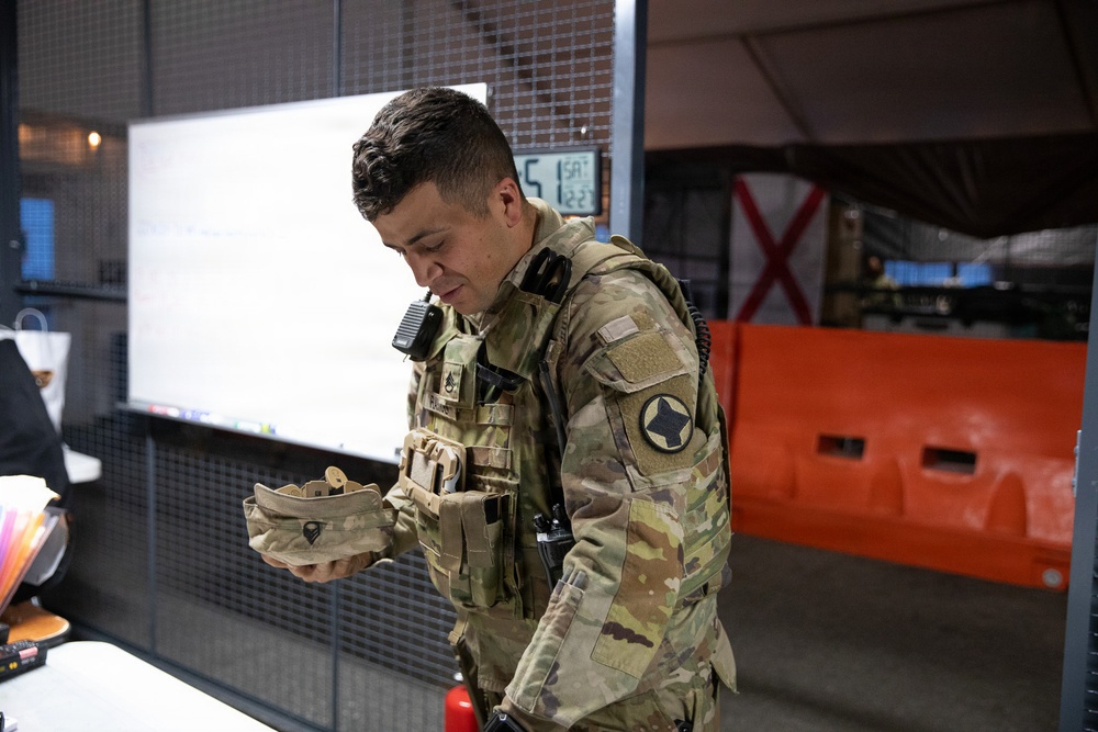 Arkansas Guardsman prepares for nighttime patrol of DC Safe and Beautiful mission