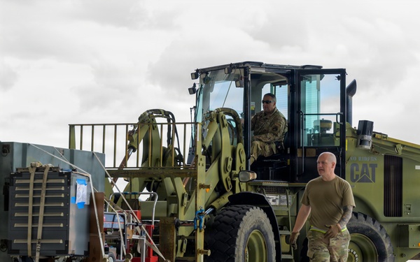 174th Attack Wing weapons specialists move equipment during Sentry South 26-2