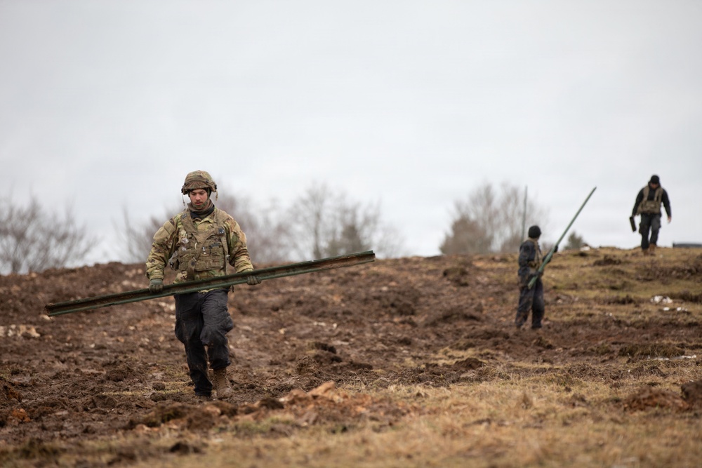 U.S. Army Soldiers Assigned to 1021st Engineer Vertical Construction Company Louisiana National Guard, Reconstruct the Battlefield.