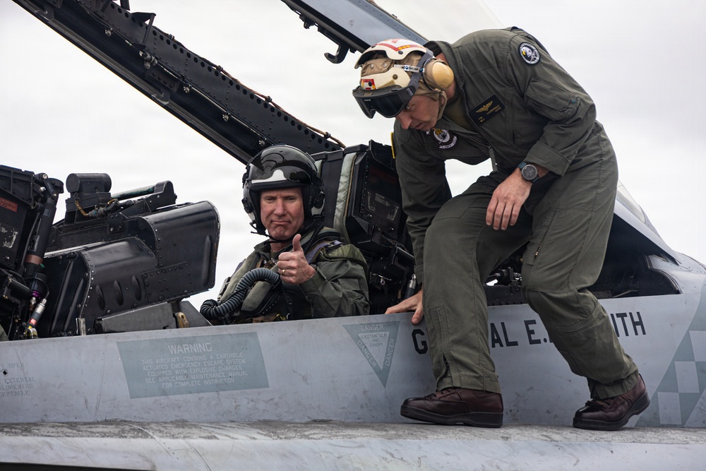 The Commandant, Gen. Eric M. Smith flies a F/A 18 at Marine Fighter Squadron 323
