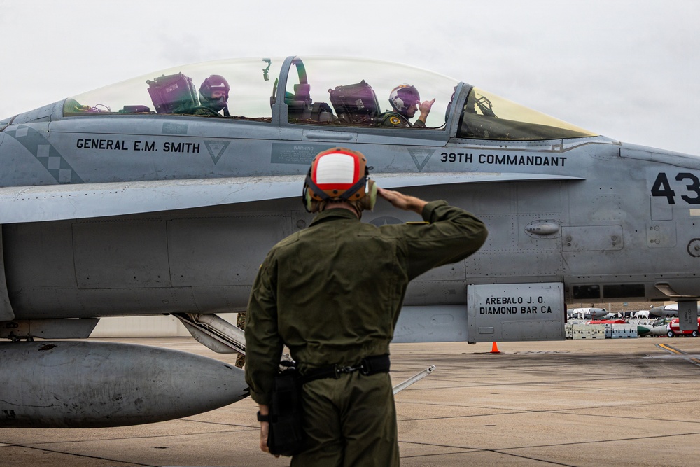 The Commandant, Gen. Eric M. Smith flies a F/A 18 at Marine Fighter Squadron 323