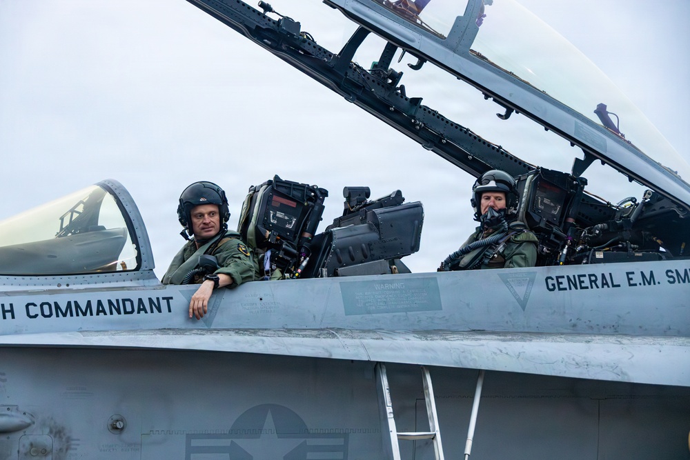 The Commandant, Gen. Eric M. Smith flies a F/A 18 at Marine Fighter Squadron 323