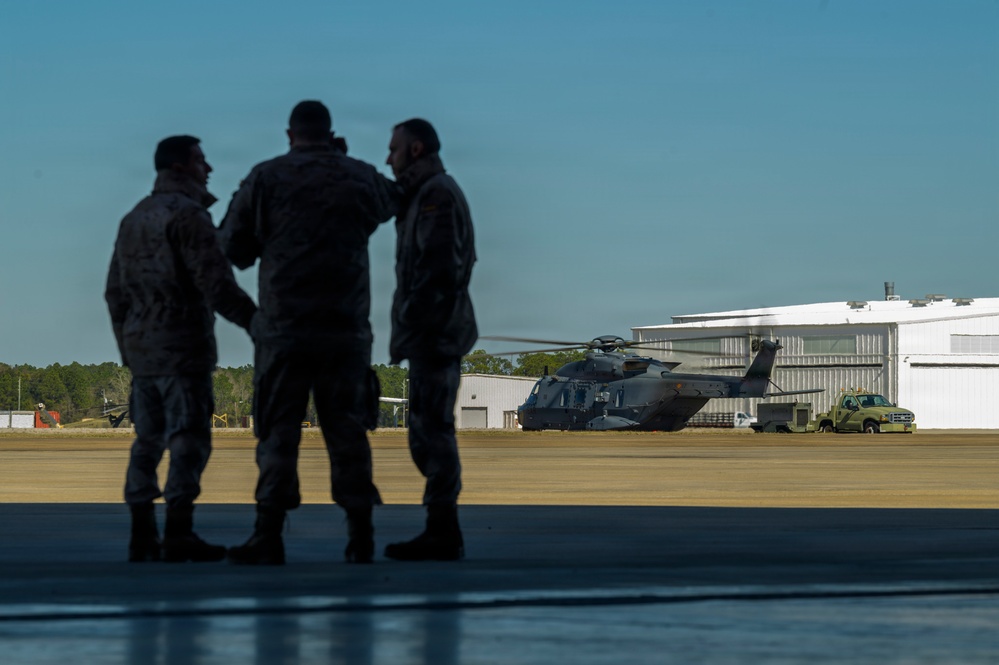 Spanish Air Force Airmen confer after NH90 flight checks during Sentry South 26-2