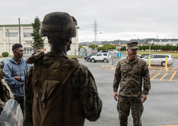 Marines partake in a riot control exercise at Camp Foster