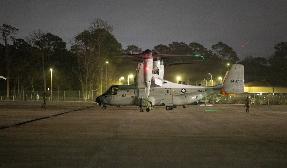 Navy VRM 40 Sailor landing CMV-22B Osprey