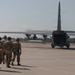 Airmen Approaching C-130 for Cargo Drop