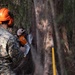 U.S. Marines with MWSS-271 conduct tree-felling operations