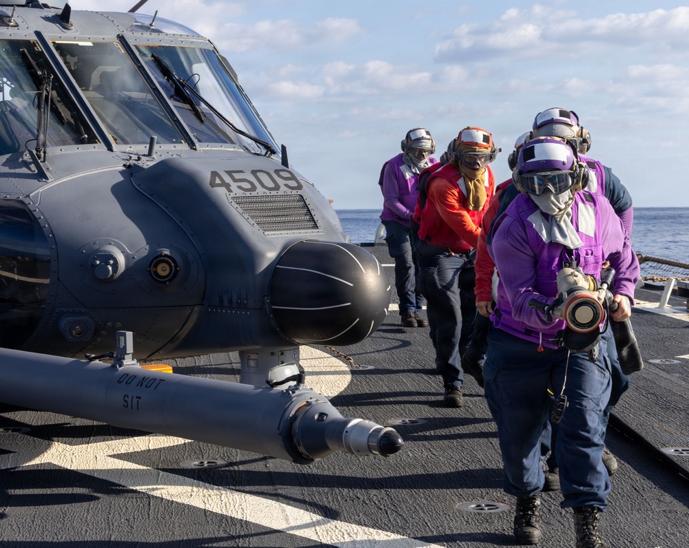 USS Milius (DDG 69) refuels 33rd Rescue Squadron helicopter