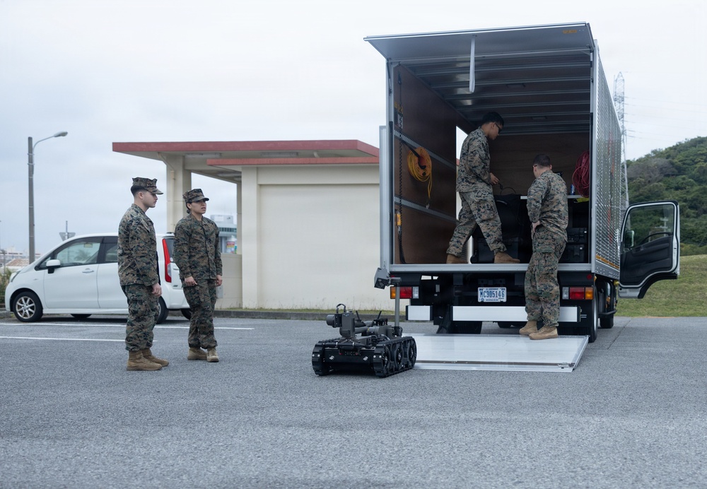 Marines respond to a simulated bomb threat during base defense exercise