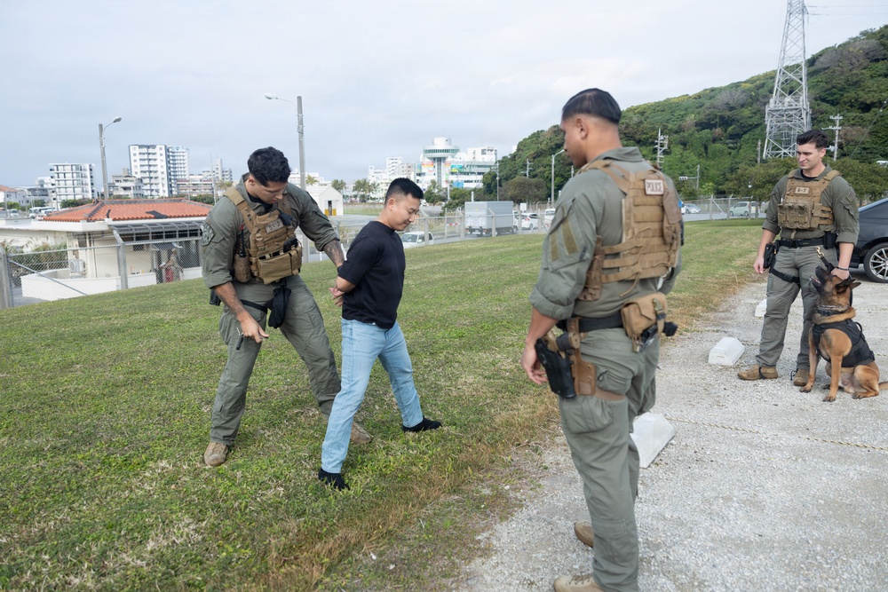Marines respond to a simulated bomb threat during base defense exercise