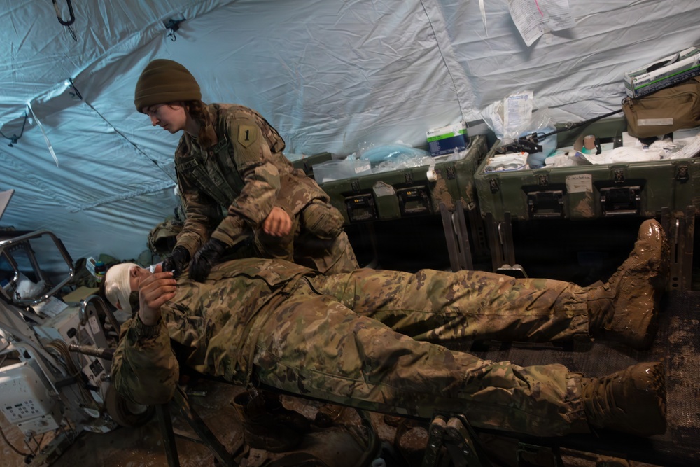 U.S. Army Soldier is Treated by Pfc. Maggie West During a Casualty in a Mass Casualty Training Event During Combined Resolve 26-05