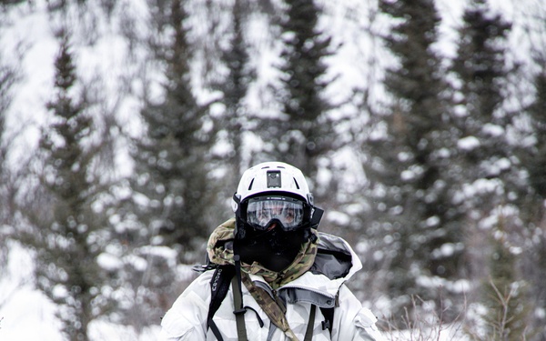 Green Beret operates snowmobile through Alaskan wilderness