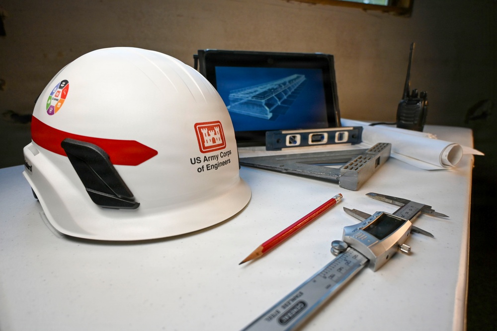USACE Hardhat and Engineering Tools on Drafting Table