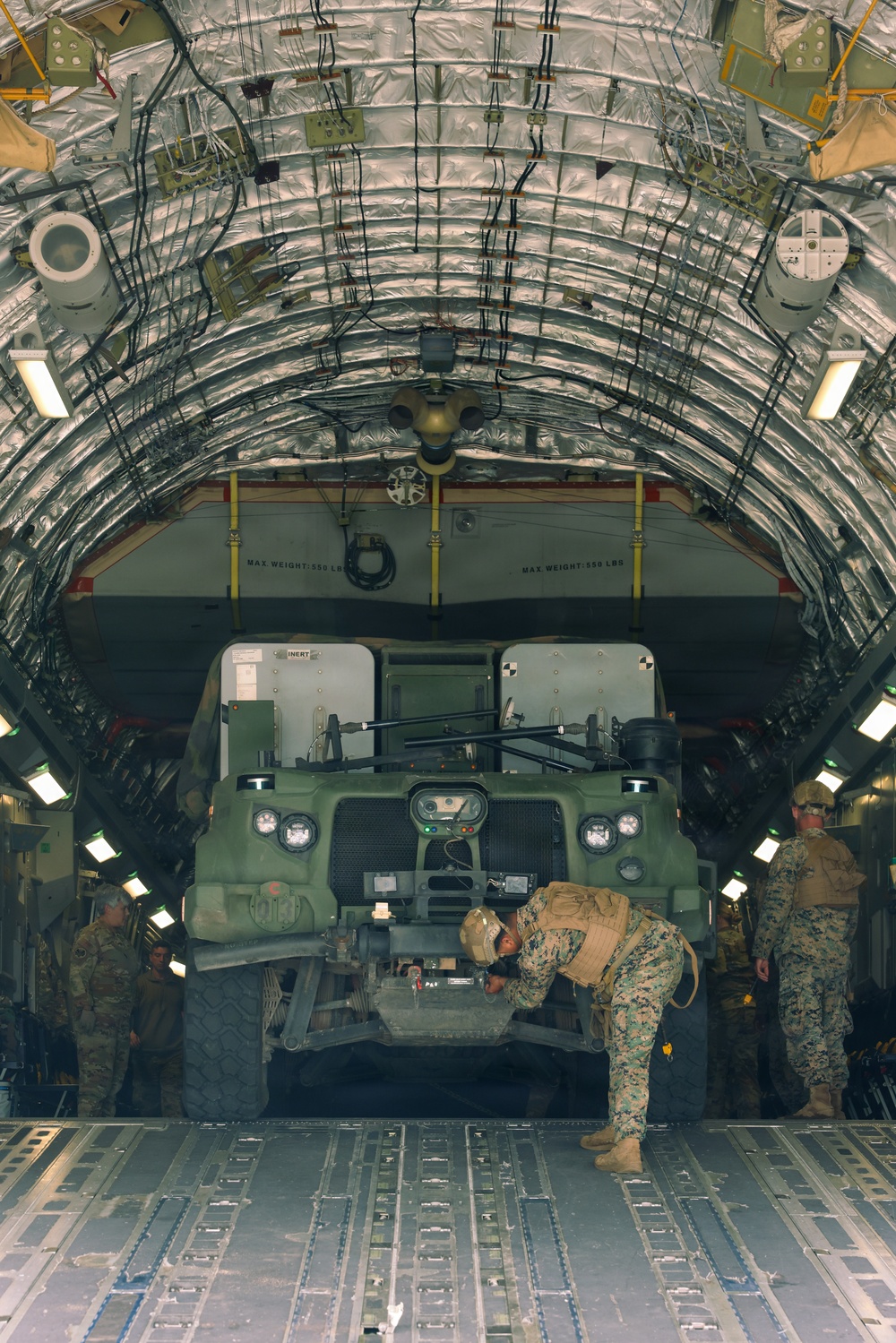 3rd MLR Marines off-load equipment from C-17 Globemaster III