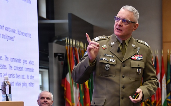 Polish Lt. Gen. Piotr Błazeusz speaks to participants during the Strategic Competition in Russia course