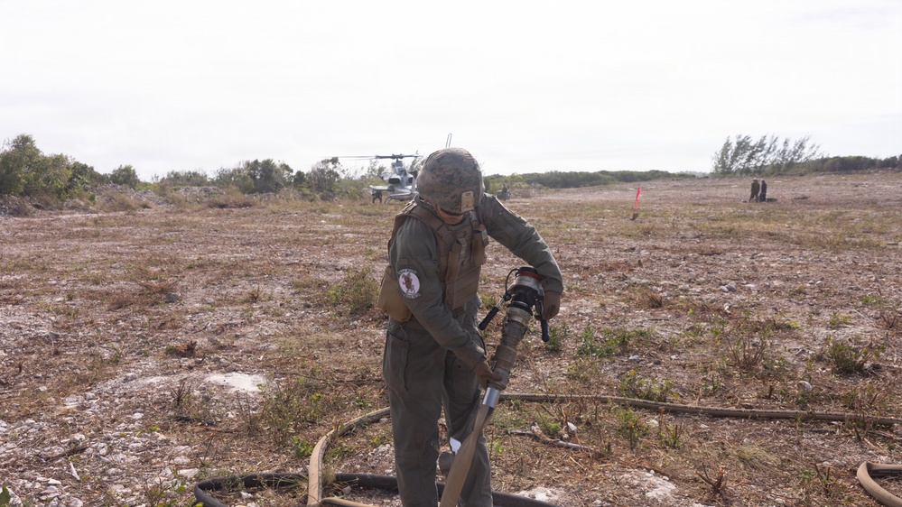 U.S. Marines with MWSS-271 refuel AH-1Z vipers with HMLA-269