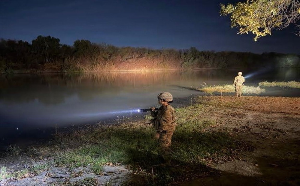 U.S. Army Soldier monitors the Rio Grande at night