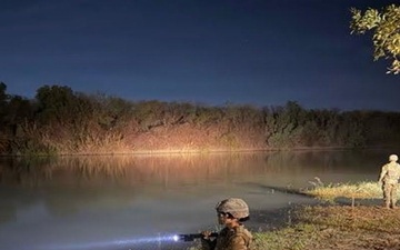 U.S. Army Soldier monitors the Rio Grande at night