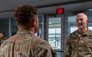 1st Cavalry Division Best Drone Warfighter competitors receive coins from Chief of Staff of the Army