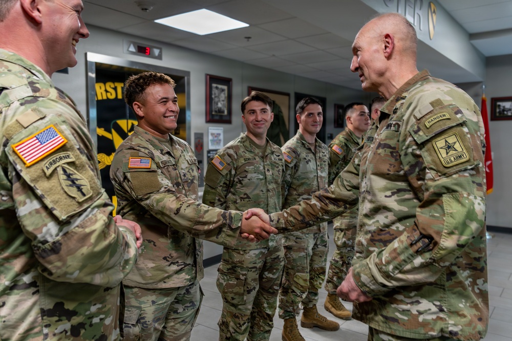 1st Cavalry Division Best Drone Warfighter competitors receive coins from Chief of Staff of the Army