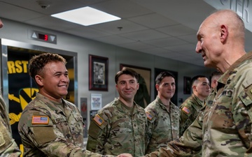 1st Cavalry Division Best Drone Warfighter competitors receive coins from Chief of Staff of the Army