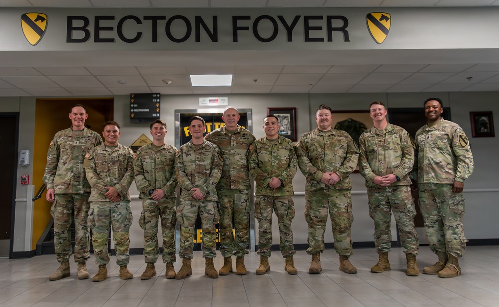 1st Cavalry Division Best Drone Warfighter competitors receive coins from Chief of Staff of the Army