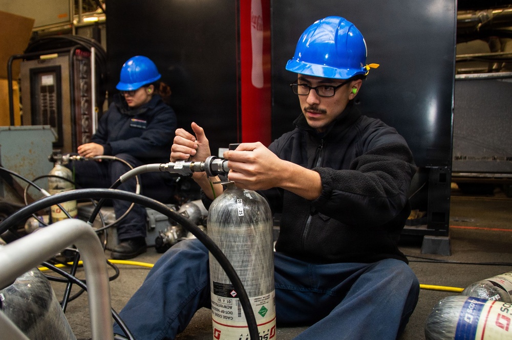 Ronald Reagan Sailors and Shipyard Workers Conduct Maintenance