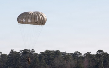 Airmen jumping from Osprey
