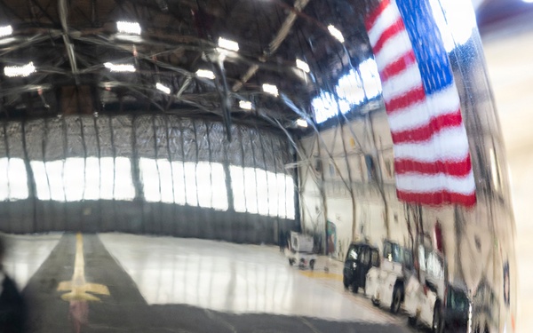 Joint Force medical experimentation team tour aircraft hangar at USCG Air Station Kodiak during ARCTIC EDGE 2026