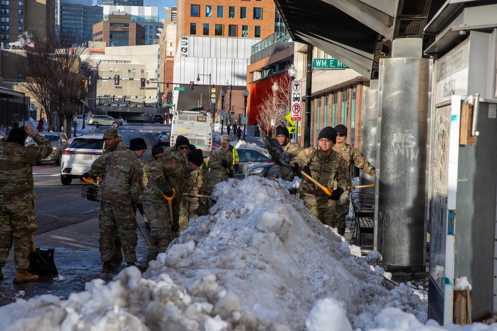 Mass Guardsmen Dig Out Boston Bus Stops