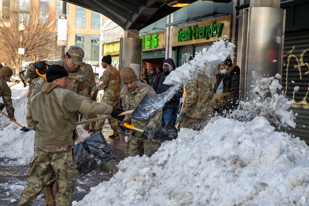 Mass Guardsmen Dig Out Boston Bus Stops