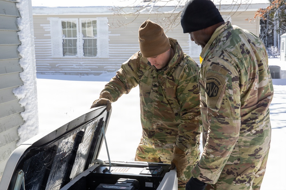 Mass Guardmen Assist Elderly Residents of Kingston