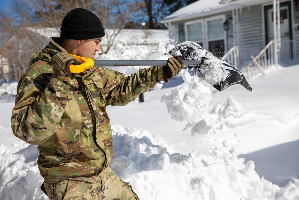 Mass Guardmen Assist Elderly Residents of Kingston