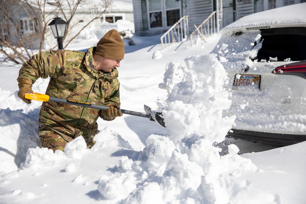 Mass Guardmen Assist Elderly Residents of Kingston
