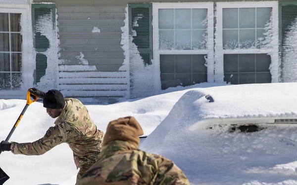 Mass Guardmen Assist Elderly Residents of Kingston