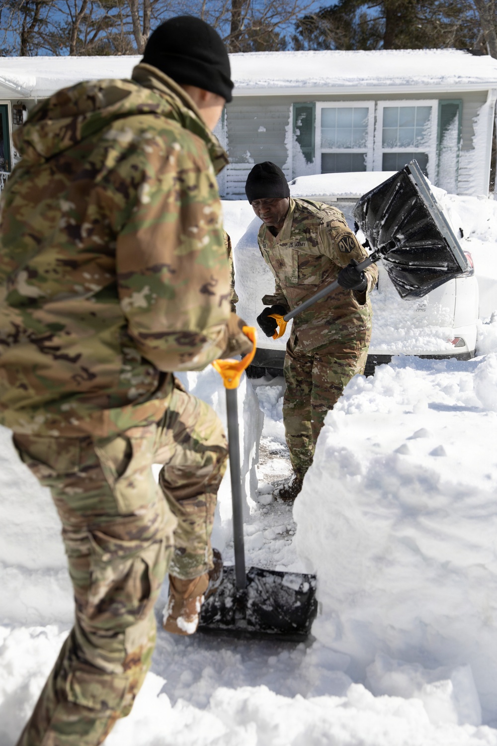 Mass Guardmen Assist Elderly Residents of Kingston