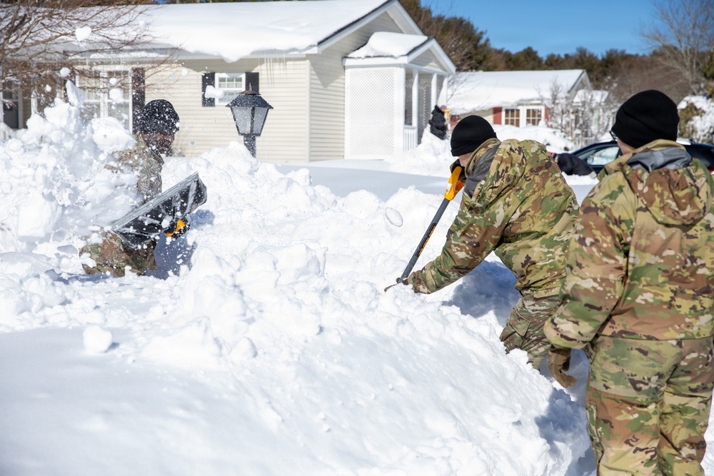 Mass Guardmen Assist Elderly Residents of Kingston
