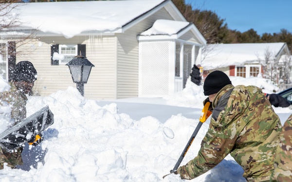 Mass Guardmen Assist Elderly Residents of Kingston