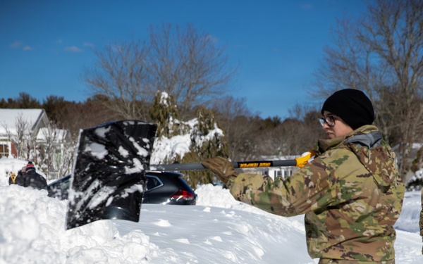 Mass Guardmen Assist Elderly Residents of Kingston