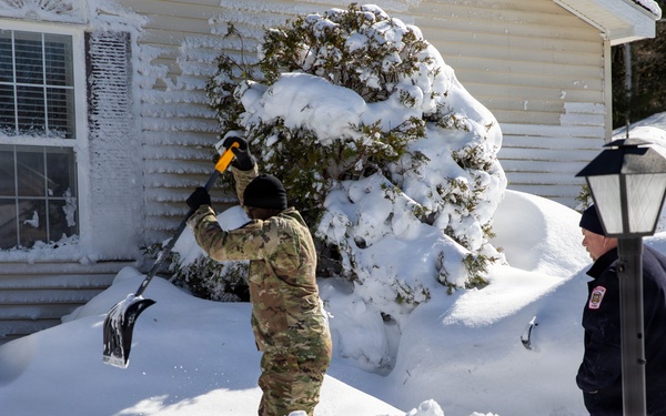 Mass Guardmen Assist Elderly Residents of Kingston