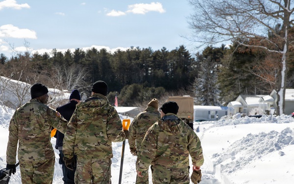 Mass Guardmen Assist Elderly Residents of Kingston