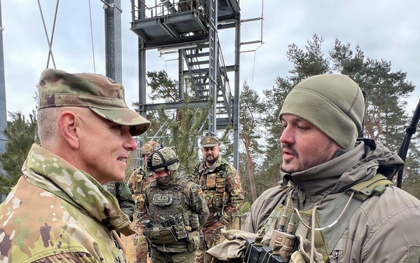 Major General Sean Flynn speaks with Czech soldier during NATO exercise