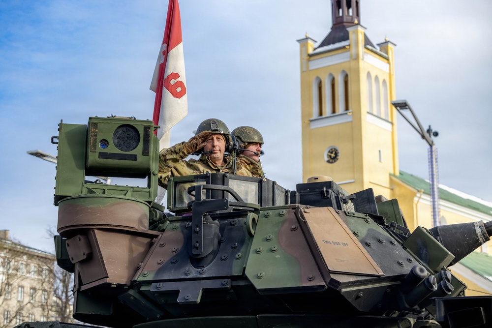 U.S. Soldier Salutes On Top of a M2A1 Bradley during Estonian Independence Day Parade
