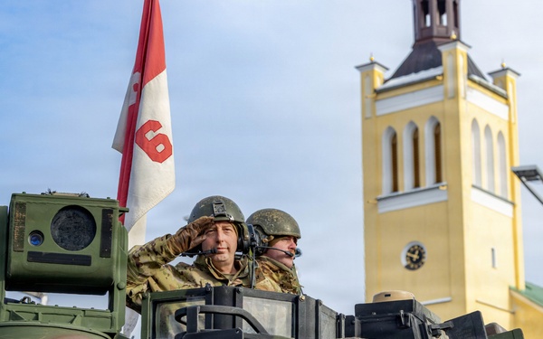 U.S. Soldier Salutes On Top of a M2A1 Bradley during Estonian Independence Day Parade