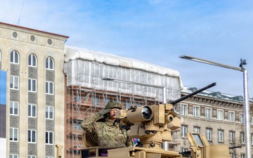 U.S. Soldiers Salutes On Top of a M1A2 Abrams During Estonian Independence Day Parade