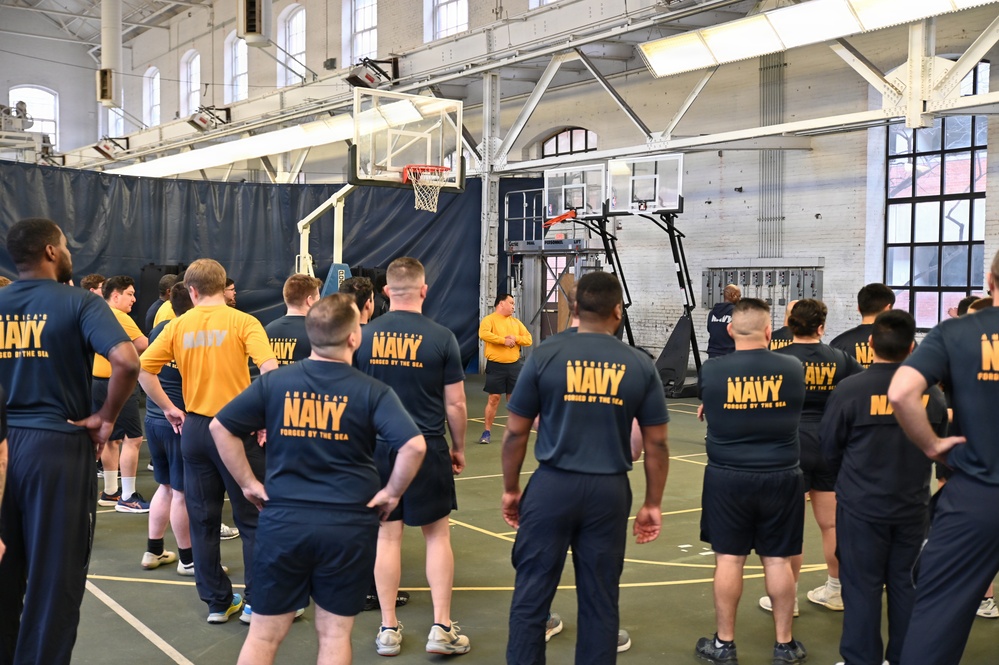 NSAW Sailors observe fitness instructor during session