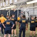 NSAW Sailors observe fitness instructor during session
