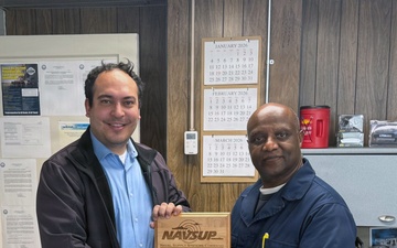 Jesse Denton receives his COQ award